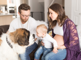 Photo of parents, young boy and St. Bernard